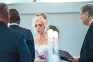 Wedding photography of the bride and groom exchanging vows captured in Tampa, FL